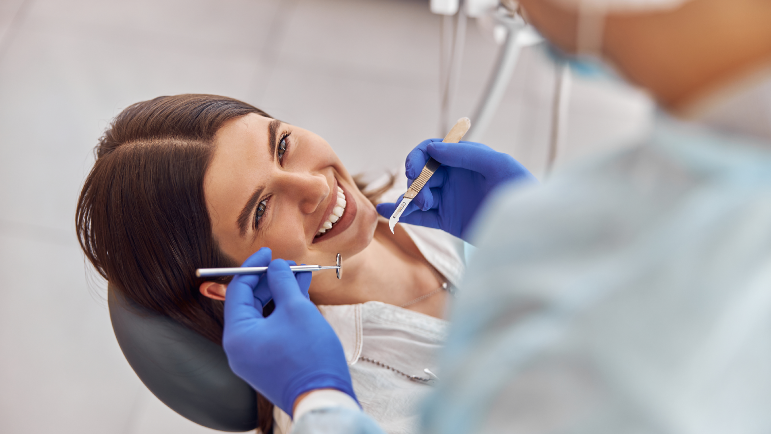 A photorealistic modern dental clinic in Turkey with a middle-aged patient seated in a dental chair.