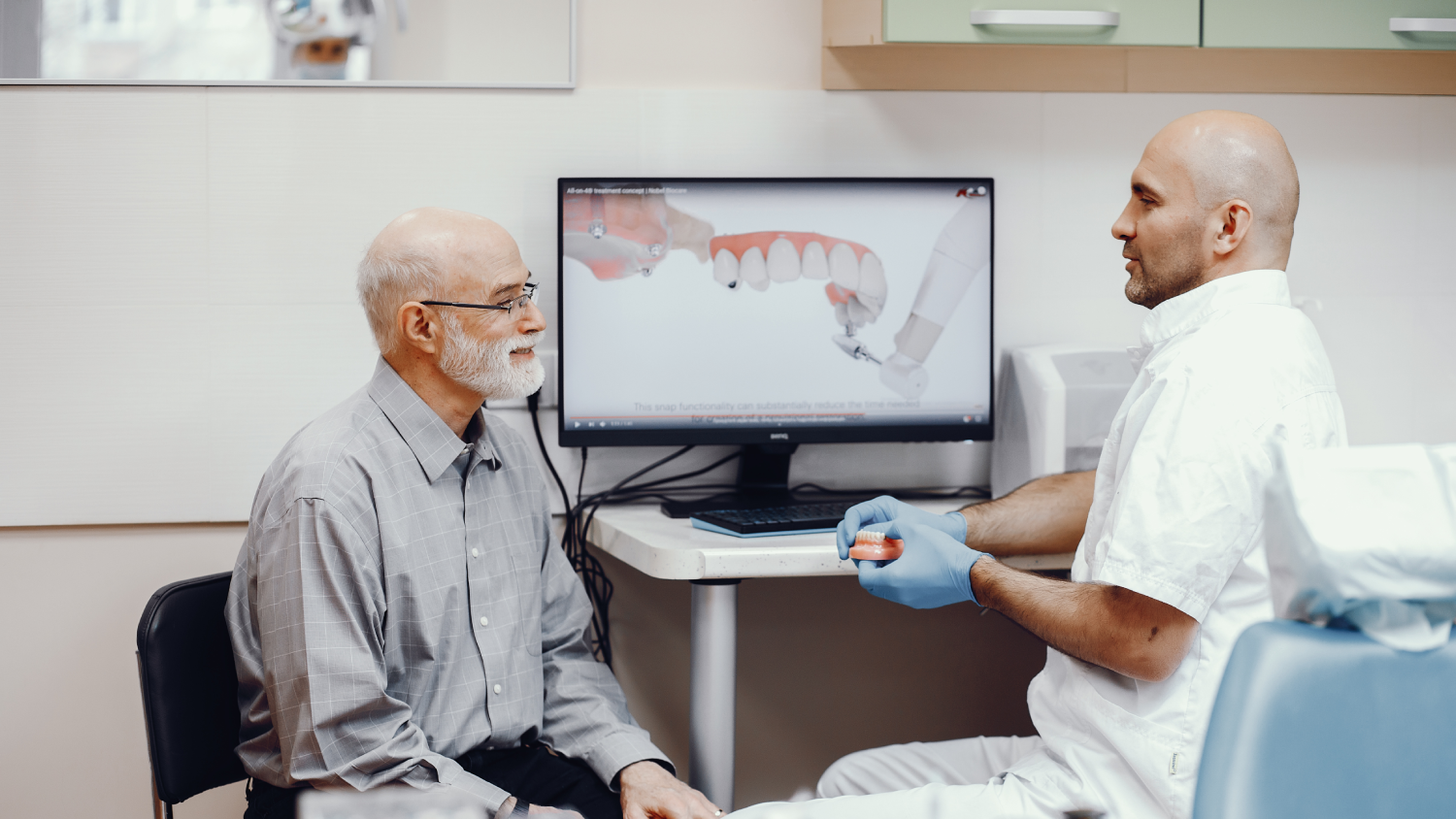A modern Turkish dental clinic with a middle-aged patient seated in a dental chair