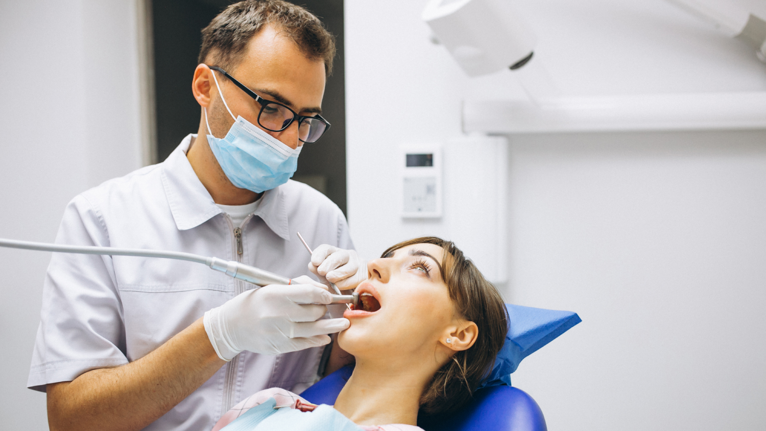 A realistic photo of a Turkish dental clinic shows a dentist in a white coat