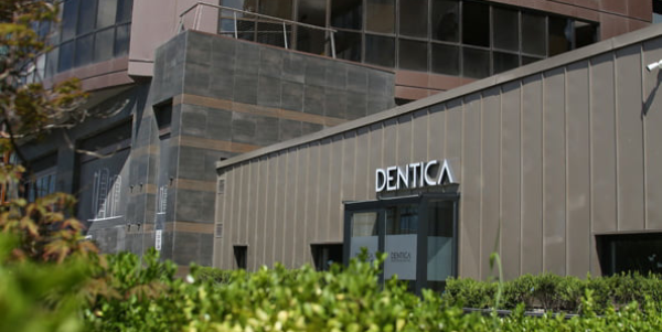 Dentica International background